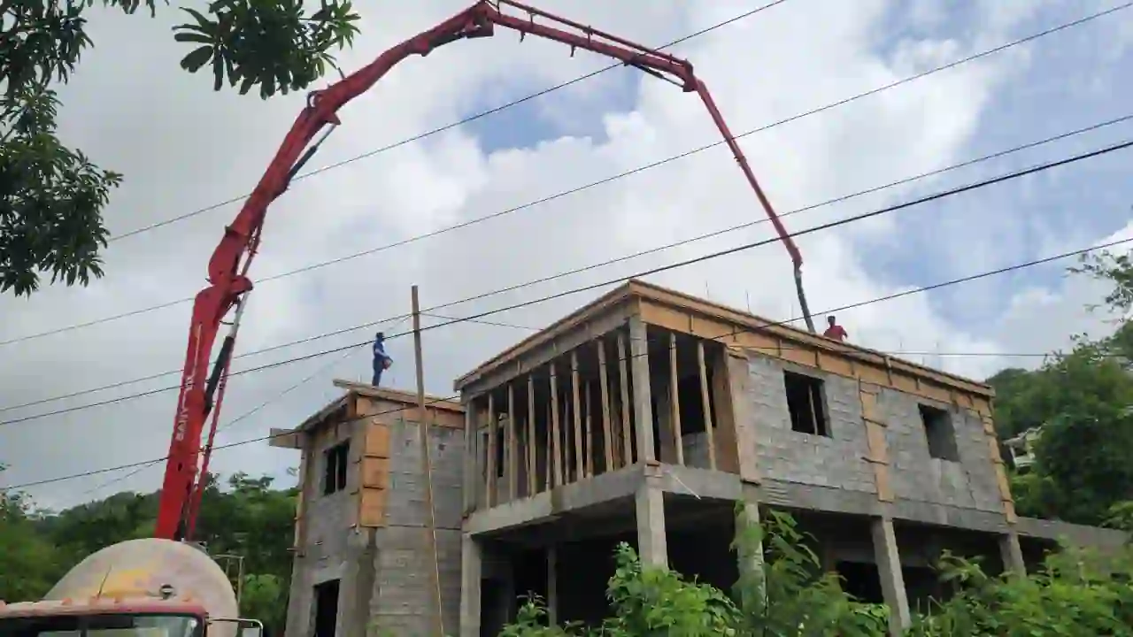 A crane being used on the roof of a construction site